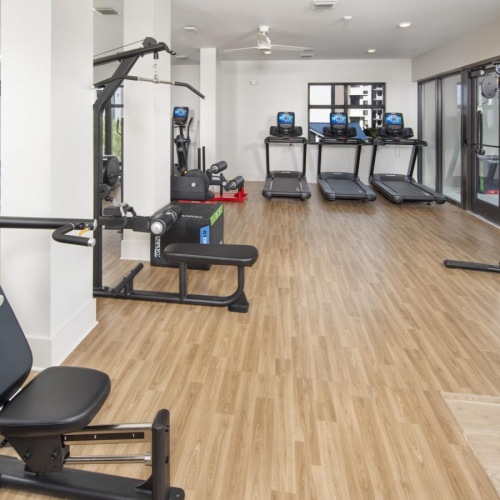 Cutting-edge amenities at your fingertips a gym with exercise equipment