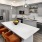 a kitchen with a table and chairs