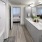 a bathroom with a tub sink and a mirror