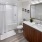 a bathroom with a tub sink and toilet
