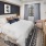 a bedroom with a bed and a mirror